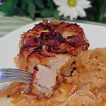 Oma’s baked pork chops with sauerkraut is an easy German dinner that’s quick to make. Adding both browned onion rings and apples are scrumptious additions to this traditional meal.