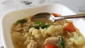 German chicken rice soup with cauliflower, carrots in a light broth.