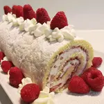 Oma's Cream Roll recipe, Biskuitrolle, is the German version of a Swiss roll or jelly roll. Filled with whipped cream and studded with berries, this is an easy-to-make treat anytime of the year.
