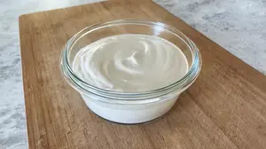 Thick, creamy, tangy dairy-free sour cream that fits right into German cooking, perfect for potatoes, cucumber salad, and creamy sauces.