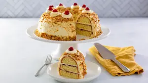 Frankfurter Kranz, aka Frankfurt Crown Cake or German Crown Cake, is a ring-shaped, three-layered cake filled with red jam and delicious German buttercream. 