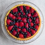 Oma's Obsttorte is a quick, easy and versatile fruit flan dessert that brings a touch of German tradition to your table. Enjoy!
