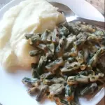 This cheesy green bean casserole recipe is a must have to add to your weeknight dinner menu. It's one of those easy side dish recipes that's really filling and can be made quickly! 