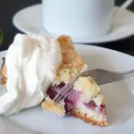 Oma's authentic German plum cake recipe without yeast uses Quark or Greek yogurt instead. So quick & easy to make this traditional Pflaumenkuchen (Zwetschgenkuchen).