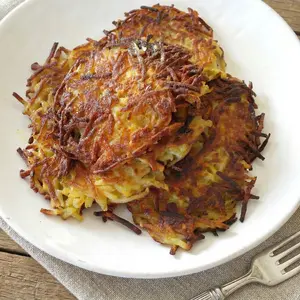 My German potato pancakes (Kartoffelpuffer) are crispy, golden, & just like Mutti made ... perfect with applesauce or a sprinkle of sugar.