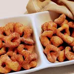 Quick, deep-fried, and rolled in cinnamon-sugar—Räderkuchen were little bites of heaven at our house. Like homemade doughnuts, only cuter.