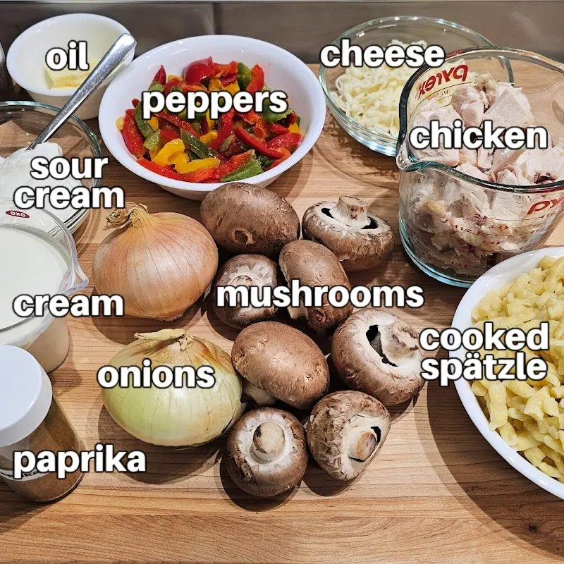 Ingredients for creamy chicken spätzle casserole with mushrooms, peppers, and rotisserie chicken