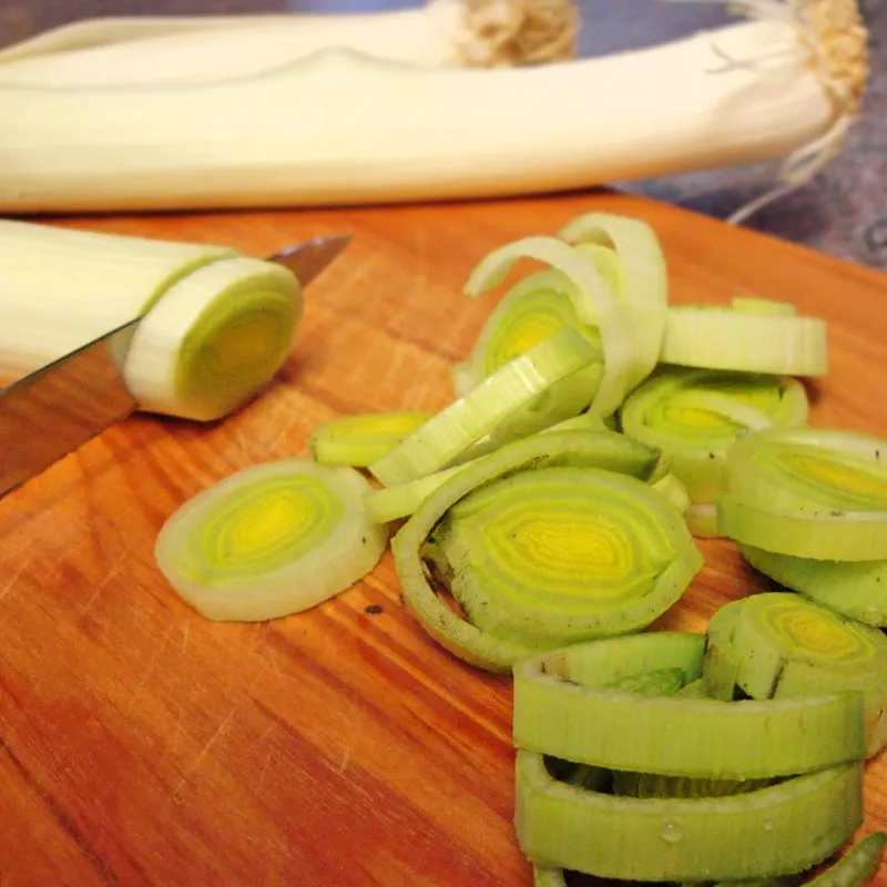 Cut Leeks Into Rings Preparing leeks by slicing them into rounds for cooking