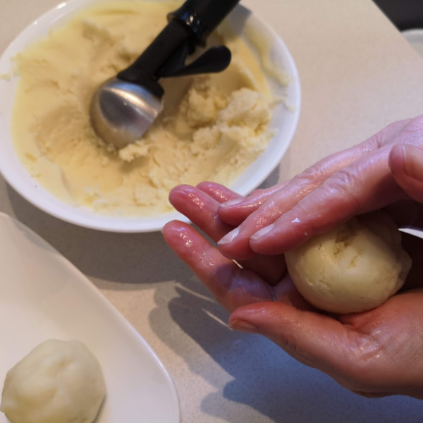 Portion out the dough using an ice cream scoop.