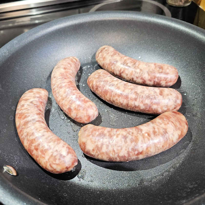 frying German Bratwurst frying German Bratwurst