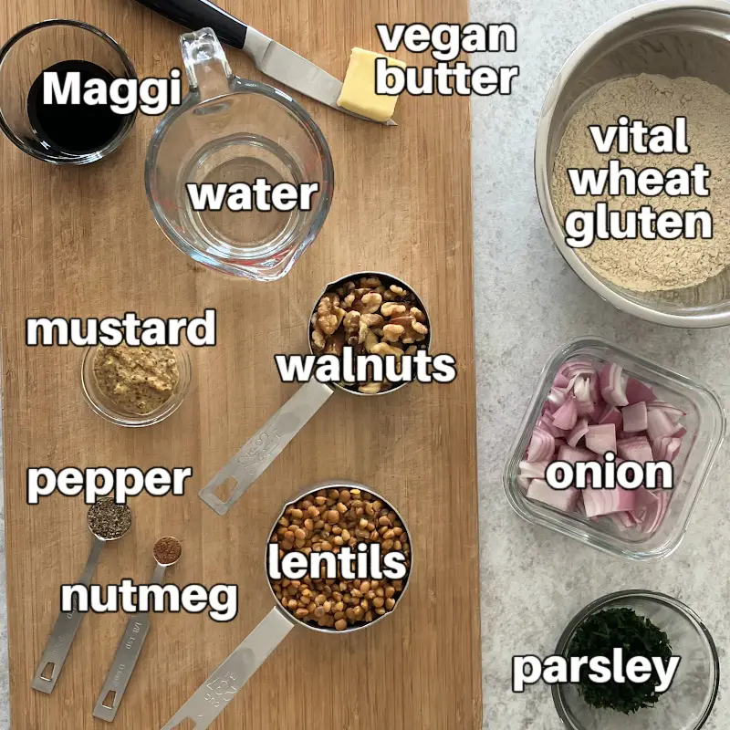 Ingredients for vegan seitan meatballs: vital wheat gluten, cooked lentils, walnuts, onion, parsley, mustard, Maggi, water, vegan butter, spices.