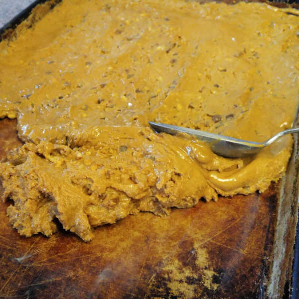 Spreading German Lebkuchen dough with spoon