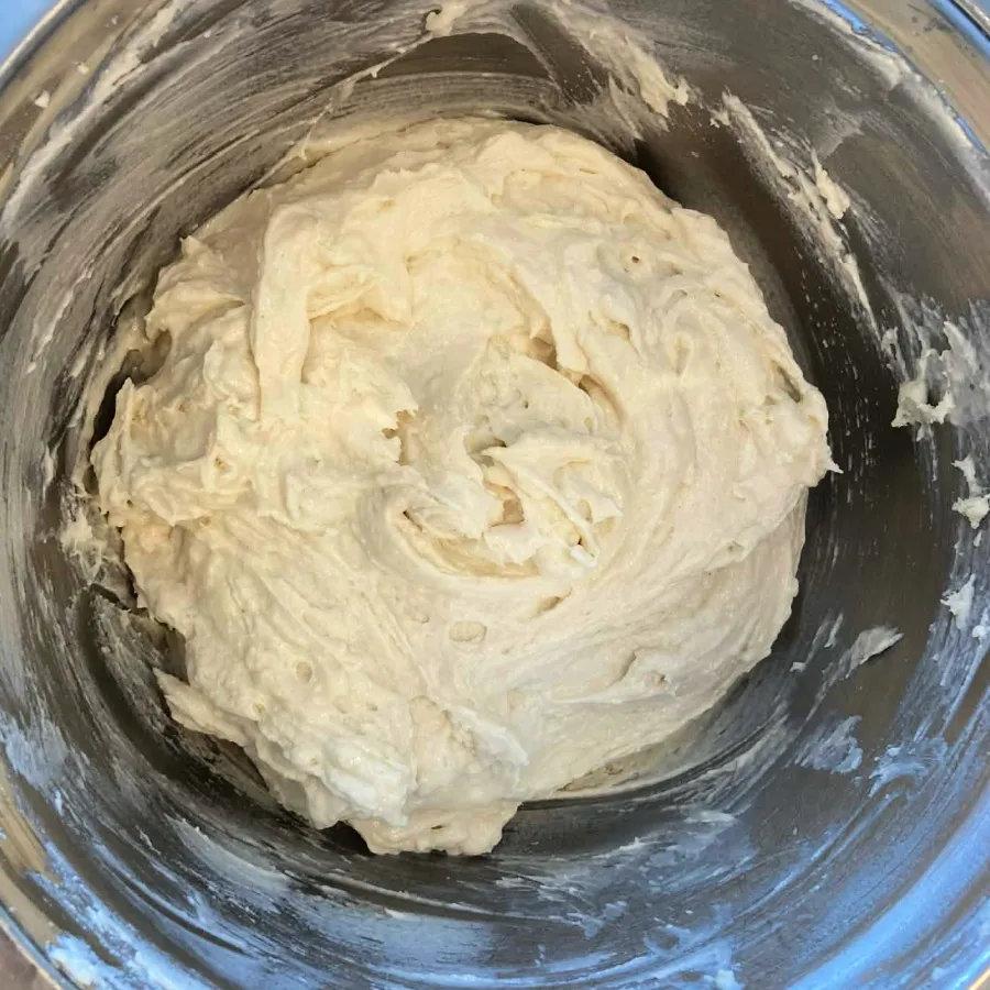 Vegan marble cake batter mixed in a bowl after adding dry ingredients and soy milk