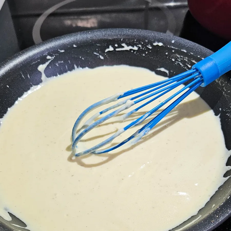 mustard sauce being whisked until lump-free