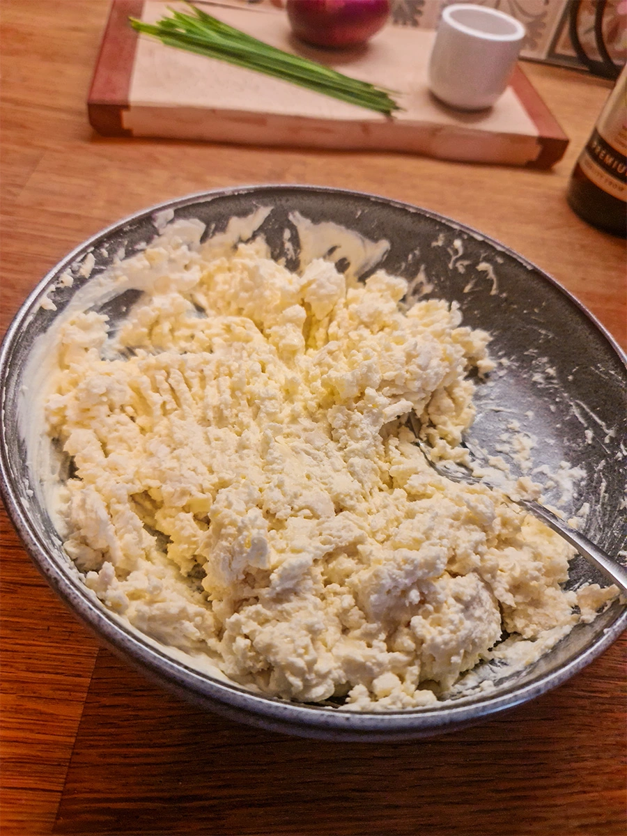 Mashed Camembert and cream cheese mixture in a bowl, ready for making Obatzda.