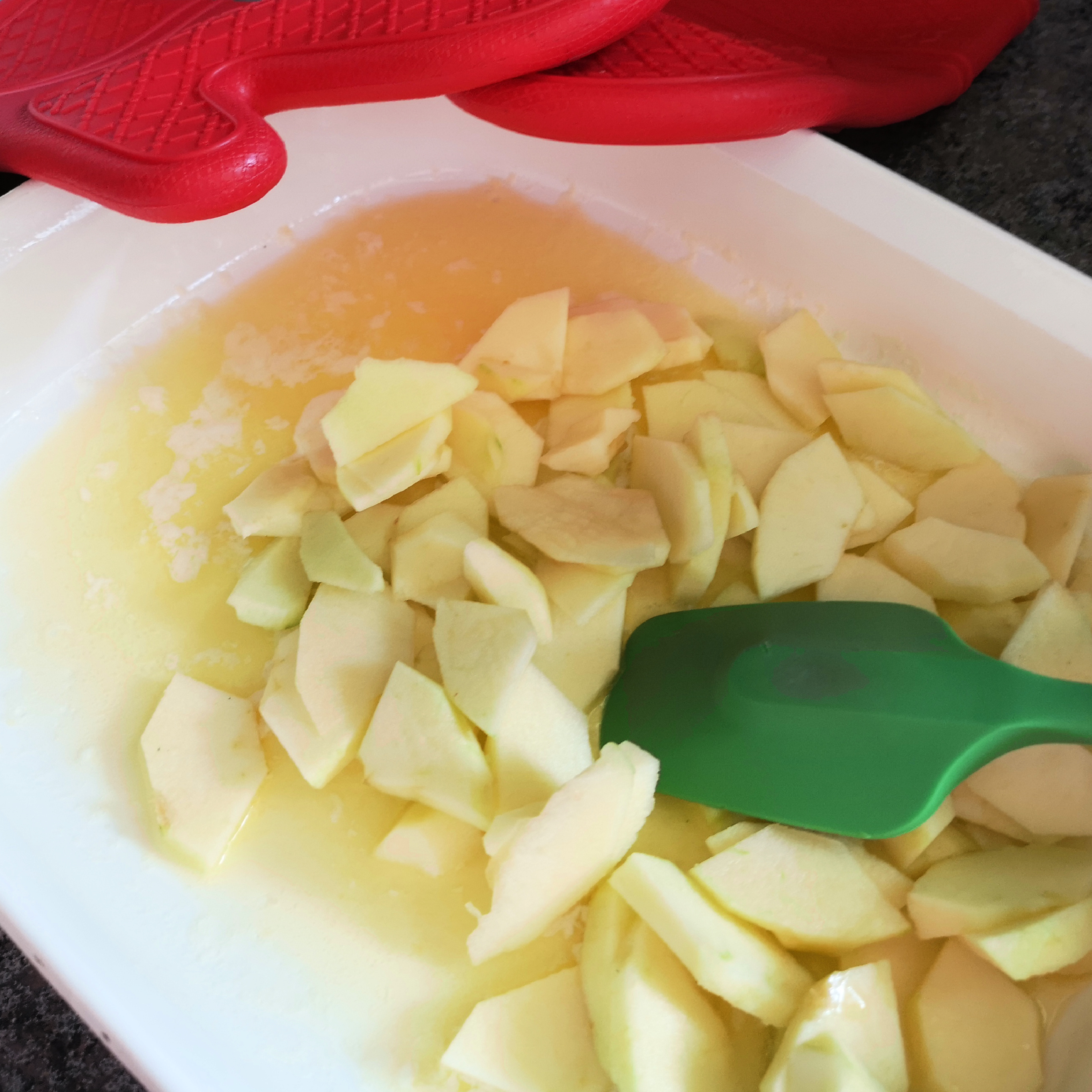 Add the sliced apples to the baking dish