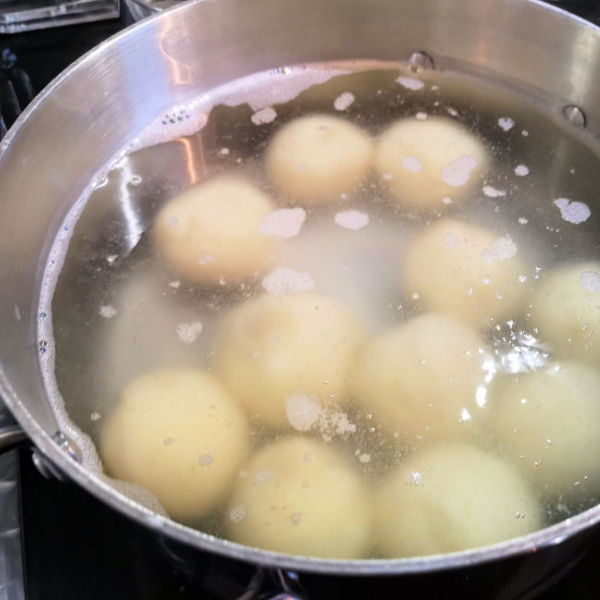 Drop dumplings into gently into simmering water