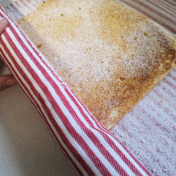 Rolling up the delicious fruit-filled cream rolls!