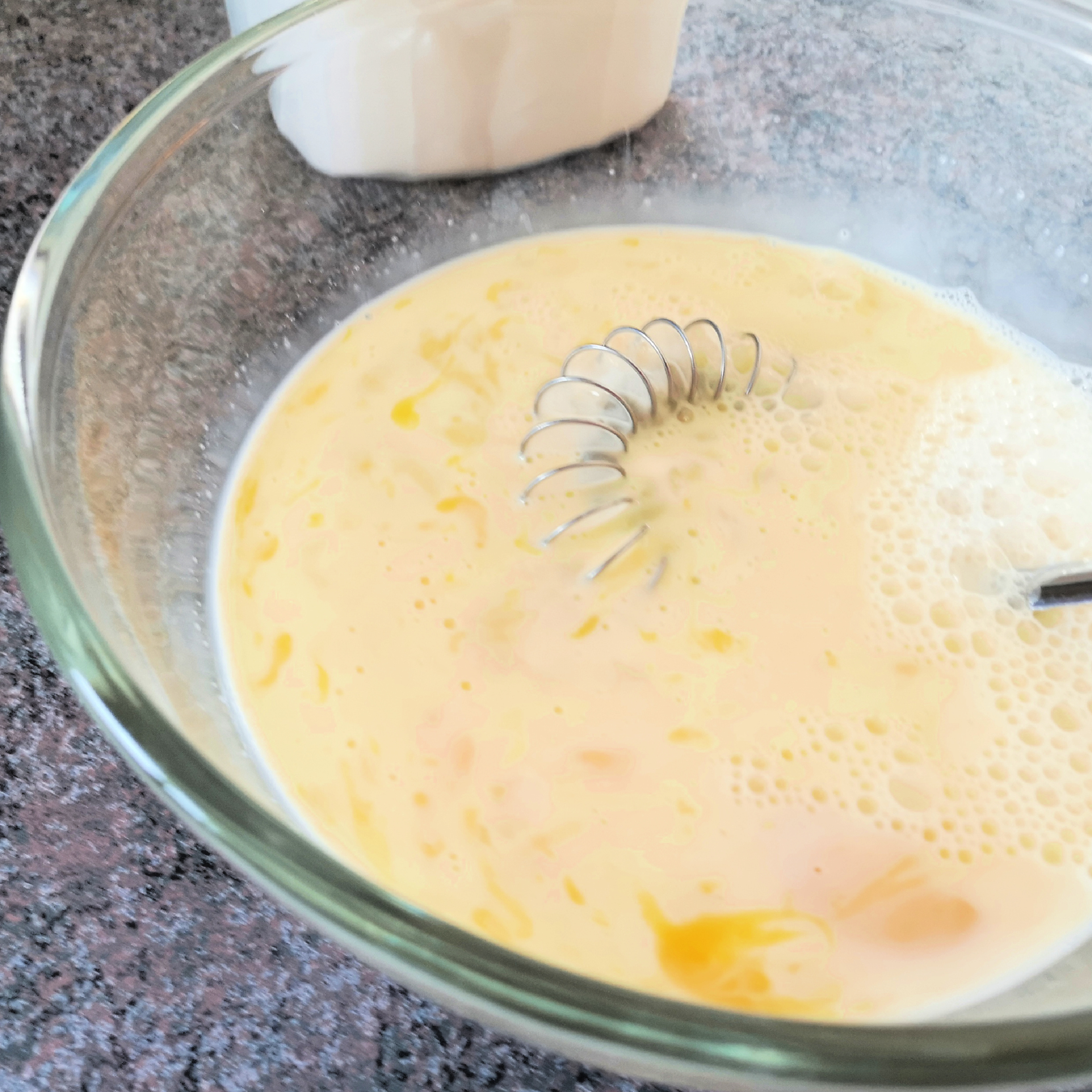 Whisk the eggs and milk together.