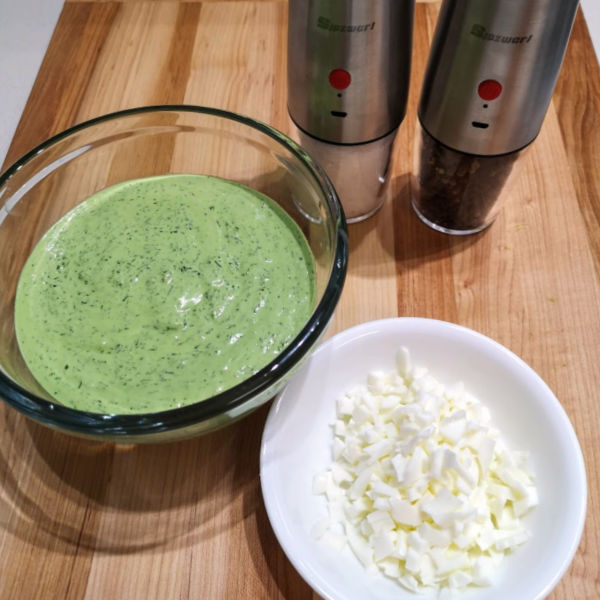 Add chopped egg whites to chilled Frankfurter Green Sauce and season