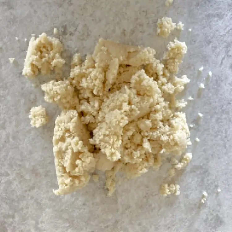 Homemade German marzipan dough turned onto a clean work surface