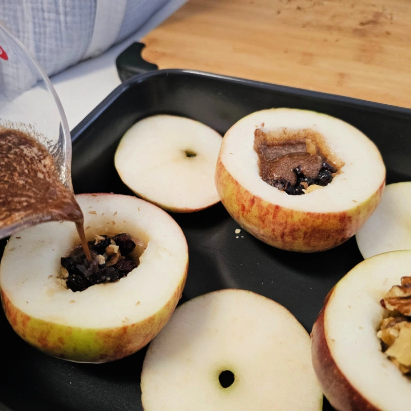 Fill the apples with the nut mixture Fill the apples with the nut mixture