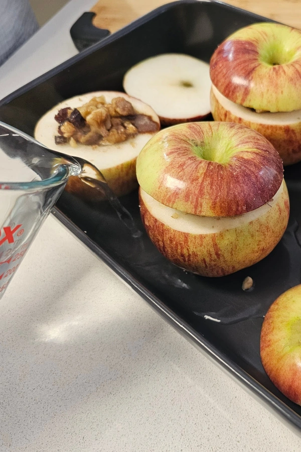 Adding water to the pan Adding water to the pan