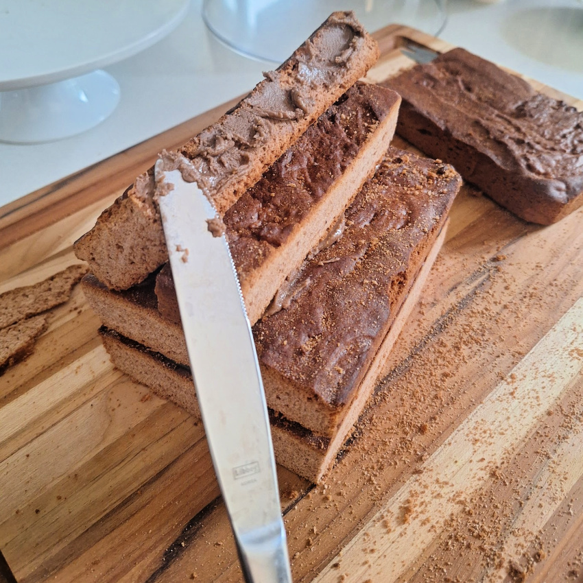 use royal icing to butter gingerbread house pieces together