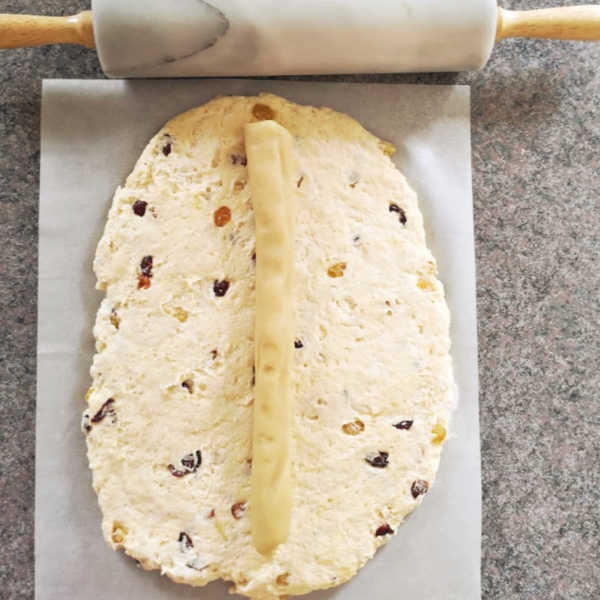 Place marzipan roll down the middle of the dough...yummy! Place marzipan roll down the middle of the dough...yummy!