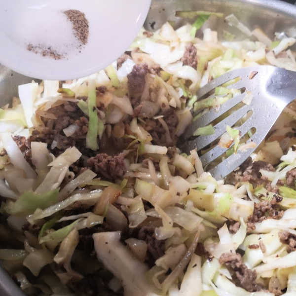 Add spices, just salt, and pepper in this case, for this lazy cabbage roll recipe. Add spices, just salt, and pepper in this case, for this lazy cabbage roll recipe.