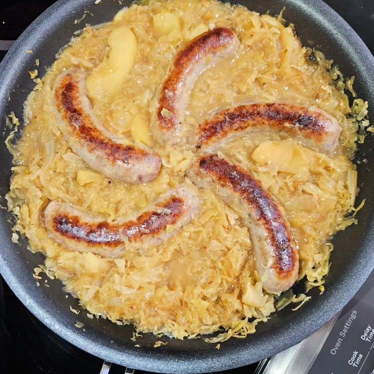 German Bratwurst and Sauerkraut ready to serve German Bratwurst and Sauerkraut ready to serve