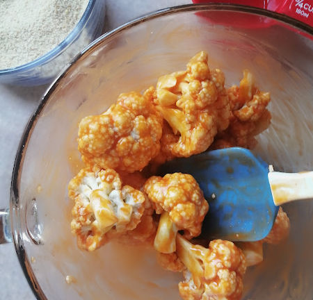 Mix sauce over cauliflower pieces until all are evenly coated. Mix sauce over cauliflower pieces until all are evenly coated.