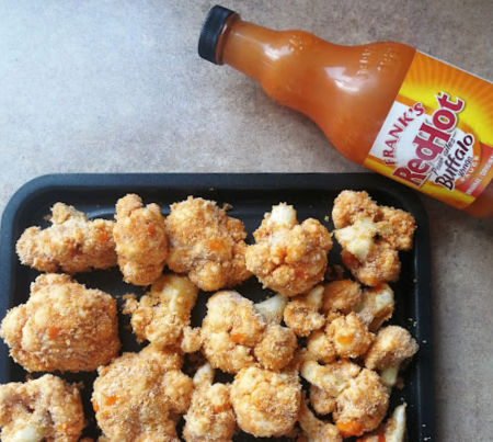 Lay in a single layer on air fryer tray and drizzle wing sauce on top. Lay in a single layer on air fryer tray and drizzle wing sauce on top.