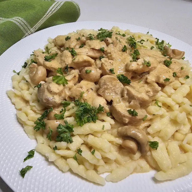 Creamy chicken stroganoff over spätzle, Oma’s German Hühnchen-Stroganoff made with heavy cream