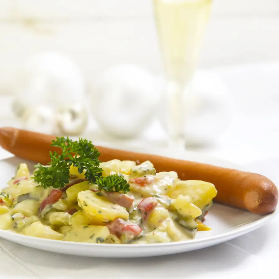 German Christmas Eve dinner with sausage and creamy potato salad