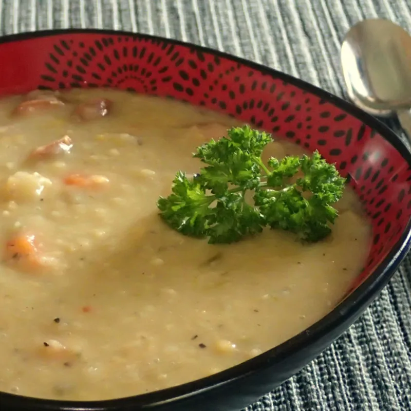 German red lentil soup with sausage, carrots, and parsley