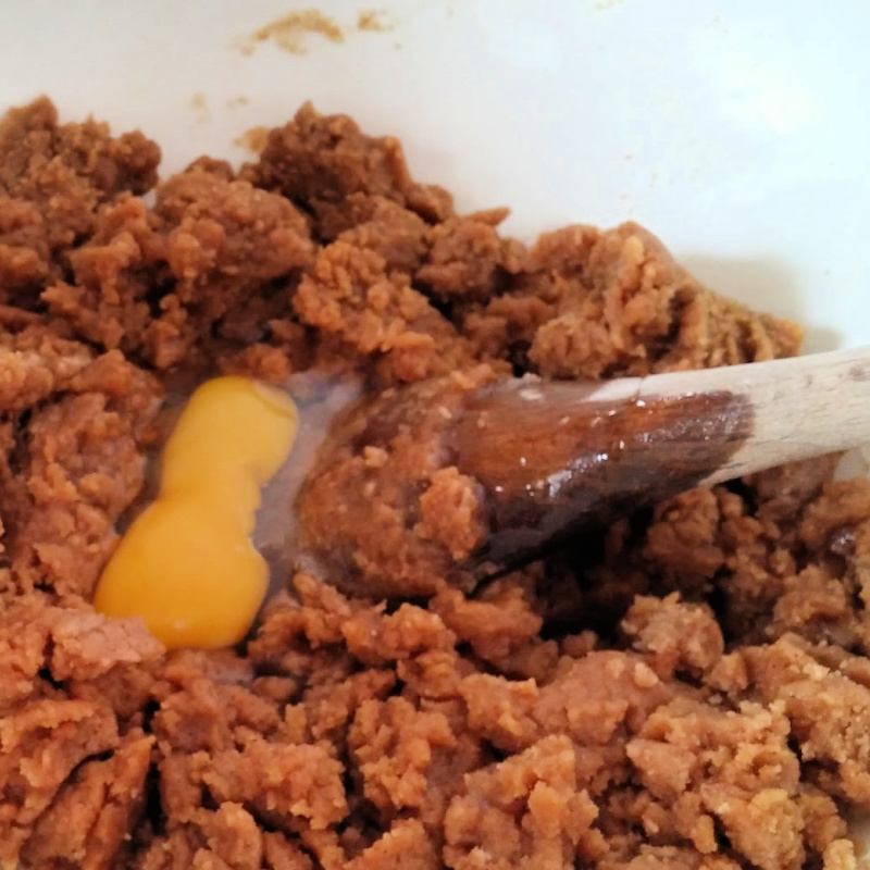 Adding Eggs to Gingerbread Cookie Dough Adding Eggs to Gingerbread Cookie Dough