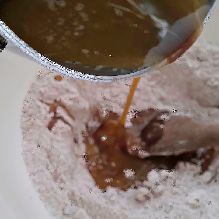 Adding Wet to Dry Ingredients to make Gingerbread Cookies Adding Wet to Dry Ingredients to make Gingerbread Cookies