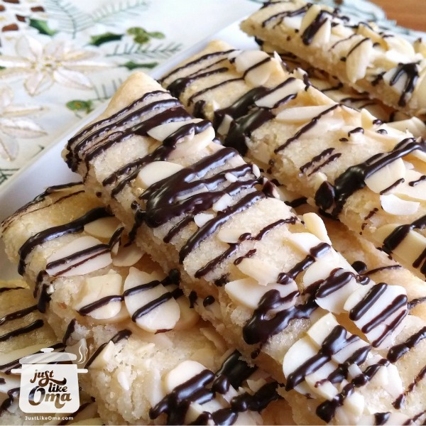 These almond bars are such a simple treat to make for your sweetheart! Easy to make, and easy to eat while curled up on the couch with your favorite movie! These almond bars are such a simple treat to make for your sweetheart!