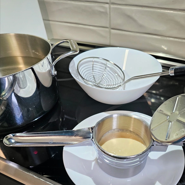 Using an assembly line makes it easy to cook spätzle Using an assembly line makes it easy to cook spätzle