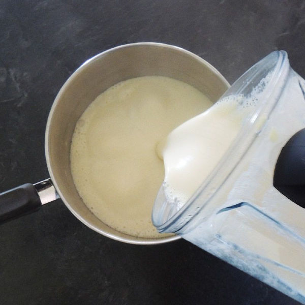 Pouring the blended cauliflower into the pot, getting ready to add that cheesy sauce. Pouring the blended cauliflower into the pot, getting ready to add that cheesy sauce.