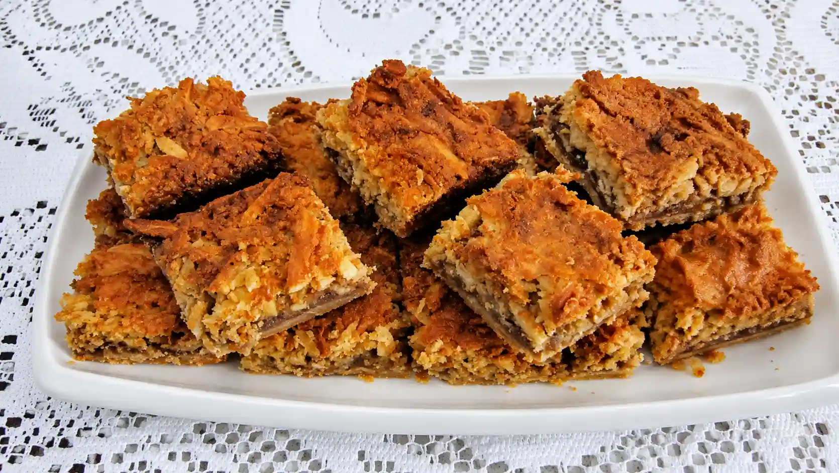 Oma's coconut bars are a hit! Try making this delicious German recipe that will truly impress.