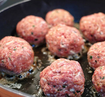 Delicious meatballs getting ready for albondigas soup! Sizzling to perfection.
