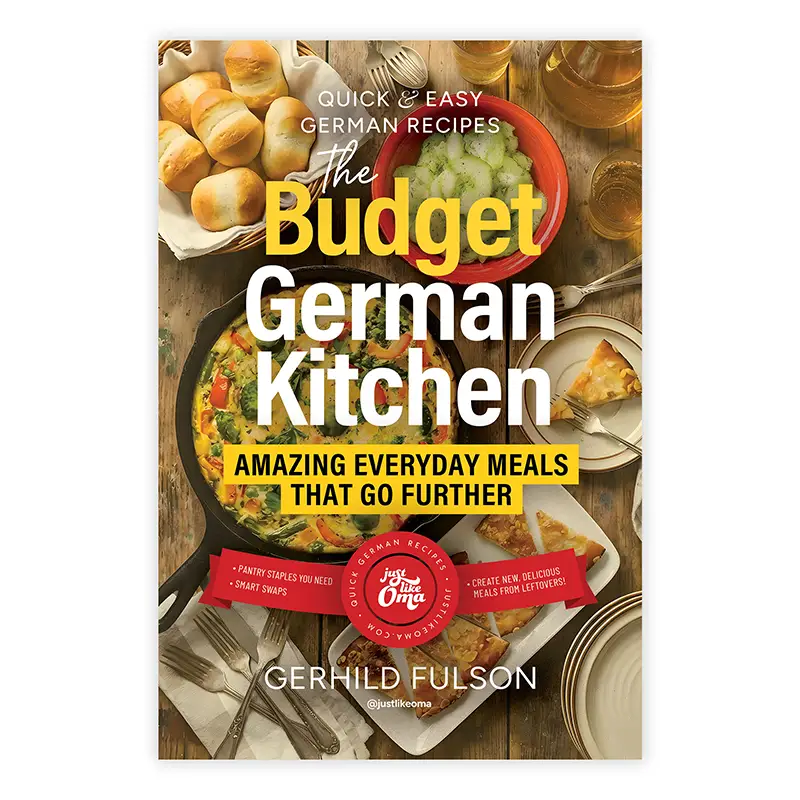 The Budget German Kitchen Quick and Easy German Recipes paperback cover featuring a skillet meal and dinner table setting.