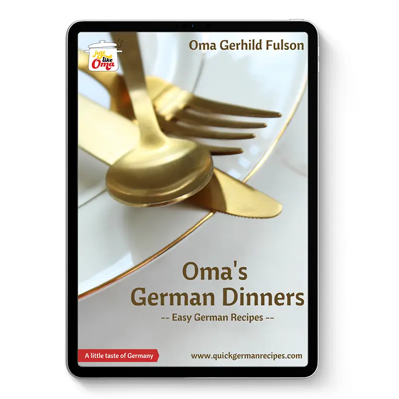 Oma’s German Dinners ebook cover on tablet with plate, cutlery, and gold-toned utensils on a light background.