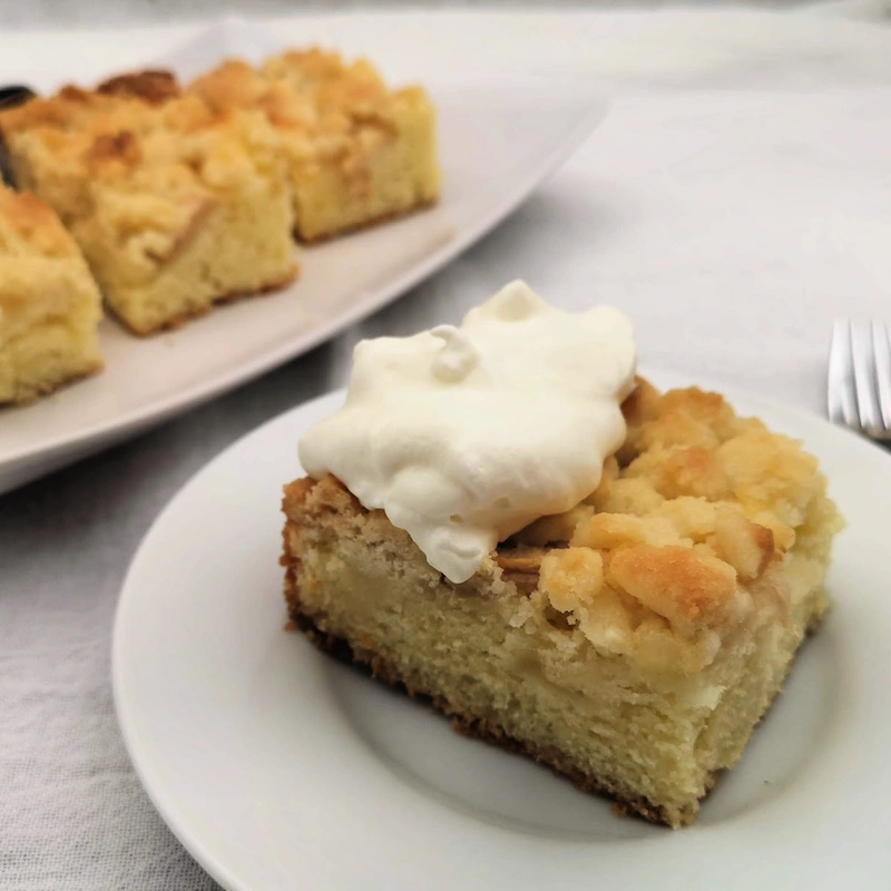 Slices of apple streusel cake on a serving plate