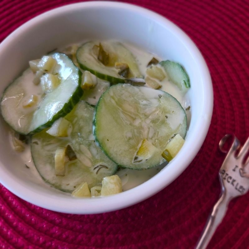 Cucumber Pickle Salad in small bowl with pickle fork