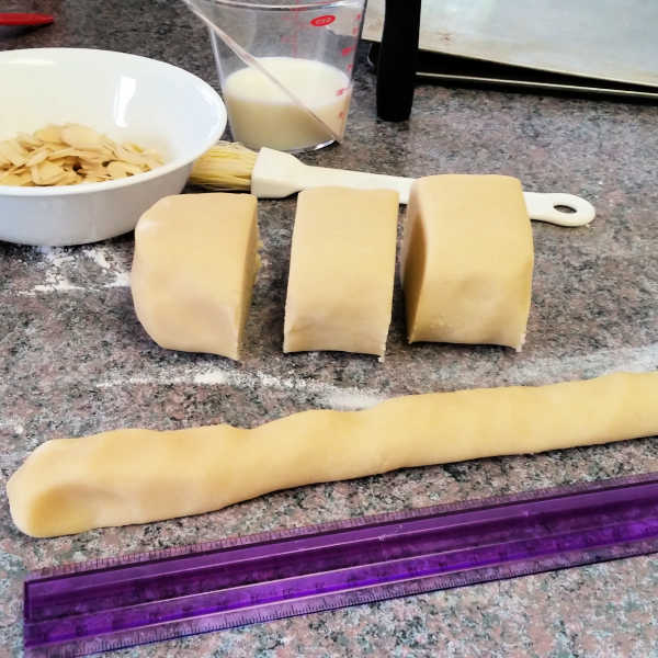 Cutting almond bar dough Cutting almond bar dough