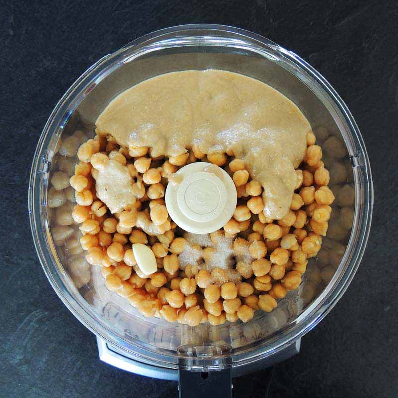 Then add tahini, salt, and a small clove of garlic. (Or more, to taste!)