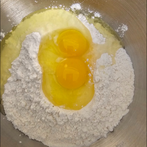 Eggs, flour, and salt in a bowl ready to make spätzle Eggs, flour, and salt in a bowl ready to make spätzle